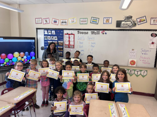 Group photo of Mrs. Joseph's students holding their Zearn certificates in the classroom