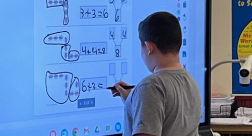 male student using interactive viewboard