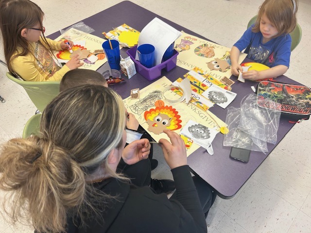 Kindergarten classroom Thanksgiving craft with parents and students at Lockley