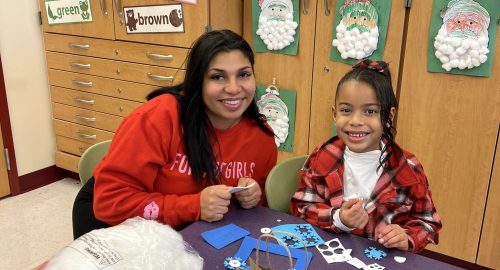 Lockley parent/guardian and working on a holiday craft together in the classroom