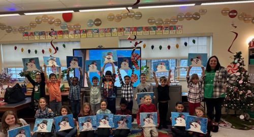 Lockley students holding their paintings of Frosty the Snowman